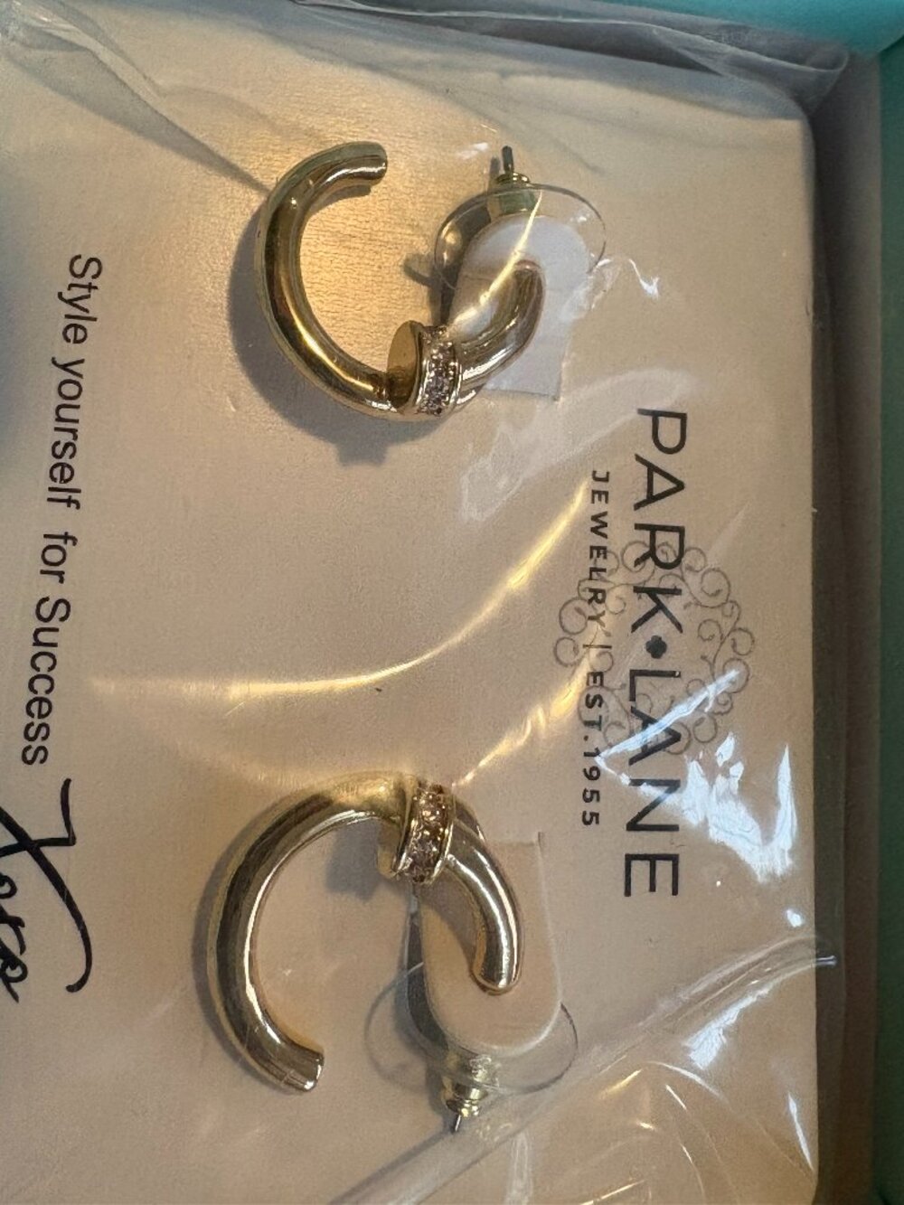 crest earrings gold